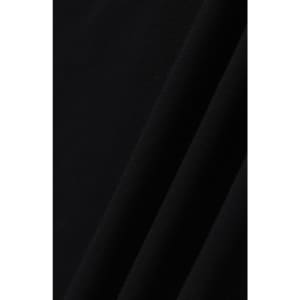 A close-up of black ultrafine cotton pique fabric, textured with a smooth finish. It features subtle folds.