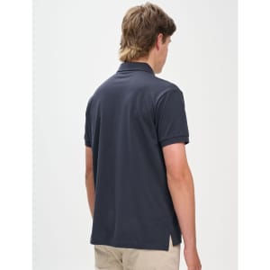 A men's ultrafine cotton pique polo in navy, featuring a back view and a simple design. It has a logo.
