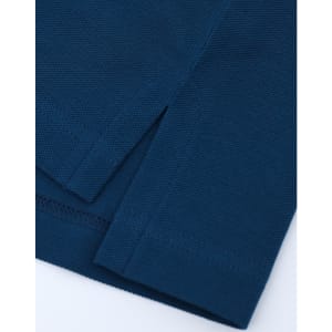 A close-up of a navy blue men's ultrafine cotton pique polo, highlighting the fabric texture and hem details.