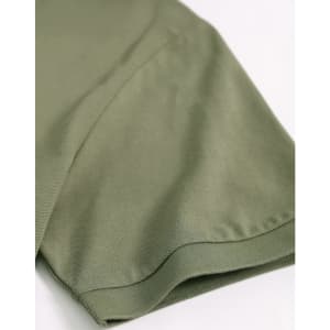 A close-up of a khaki green men's ultrafine cotton pique polo, highlighting the sleeve detail. It features a logo.