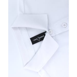 A white ultrafine cotton pique polo with a folded collar and a branding label visible inside.