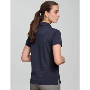A navy ultrafine cotton pique polo worn by a woman, featuring a logo and a fitted design.