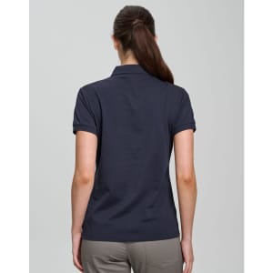 A navy ladies polo shirt made of ultrafine cotton pique, featuring a collar and short sleeves, with a logo.