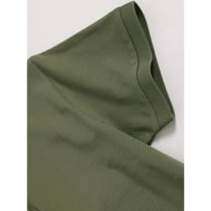 A green ladies ultrafine cotton pique polo, featuring a folded sleeve with a smooth texture and branding detail.