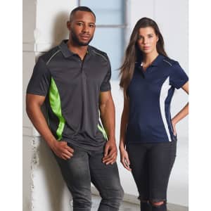 A grey men's polo with green accents and a navy women's polo with white accents, both featuring branding.