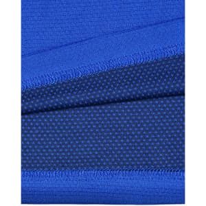 A close-up of blue bamboo charcoal fabric with textured patterns and a visible logo.