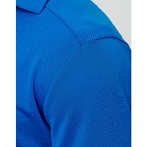 A close-up of a blue men's bamboo charcoal polo shirt, featuring a textured fabric and a collar.