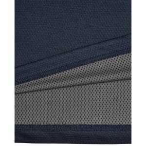A close-up of a navy blue men's polo shirt featuring a textured fabric with a contrasting inner layer.