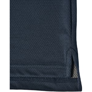 A navy blue polo shirt featuring a subtle textured pattern and a side split at the hem. It has a logo.