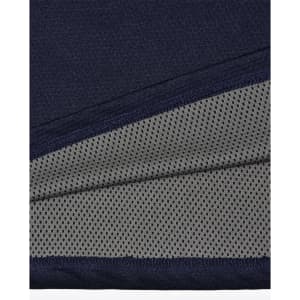 A close-up of a navy polo shirt detailing with a grey mesh inner lining, featuring a logo.