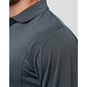 A close-up of a dark grey long-sleeve polo shirt featuring textured fabric and a collar. It has a logo on the chest area.
