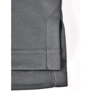 A grey sustainable poly/cotton polo shirt featuring detailed stitching and a side vent design.