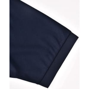 A navy blue men's sustainable poly/cotton polo shirt showcasing the cuff detail with a logo.