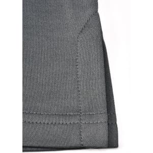 A close-up of the hem of a grey sustainable poly/cotton polo shirt featuring neat stitching and a folded edge.