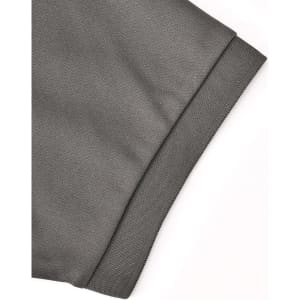 A close-up of the cuff of a grey sustainable poly/cotton polo shirt, featuring a textured fabric and an edge detail.