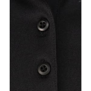 A close-up of a black polo shirt featuring buttons and a subtle texture, highlighting its sustainable fabric.