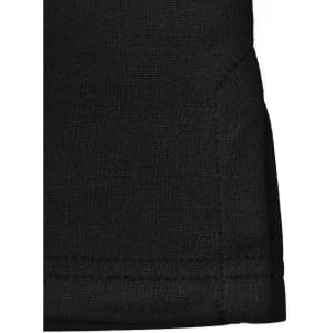 A close-up of a black sustainable poly/cotton polo shirt, featuring a neatly finished hem and a tag on the fabric.