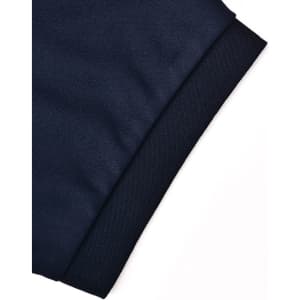A close-up of a navy blue polo shirt sleeve featuring a textured knit cuff and a logo.