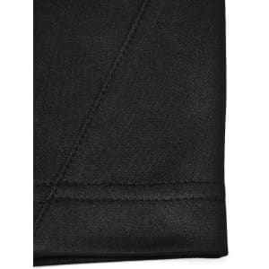 A close-up of a black polo shirt featuring a smooth fabric texture and detailed stitching.