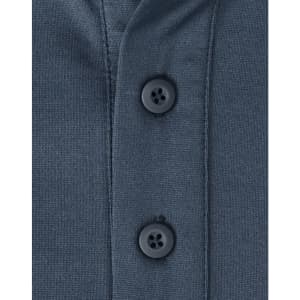 A close-up of a men's sustainable poly/cotton polo shirt in a dark colour, featuring two black buttons at the collar.
