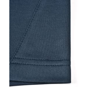 A close-up of a dark blue polo shirt fabric showing the seam detail and texture, featuring a logo.