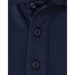 A close-up of a navy blue polo shirt featuring a button placket and a small logo.