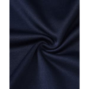 A close-up of dark navy fabric with a smooth texture, showcasing the sustainable poly/cotton blend.