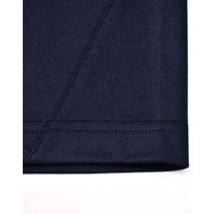Close-up of a navy sustainable poly/cotton polo shirt, highlighting the fabric texture and stitching details.