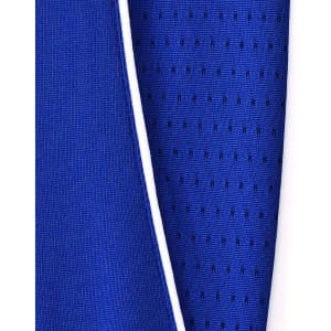 A close-up of a blue polo shirt featuring contrasting fabric textures and a white trim. It has a logo on the garment.