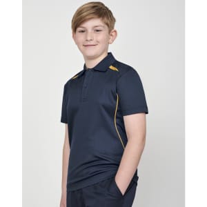 A boy wearing a navy polo shirt with yellow contrast trim and a logo on the chest.