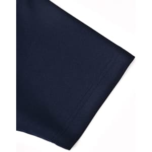 A close-up of a navy polo shirt sleeve, showcasing the fabric and stitching detail. The shirt has a logo.