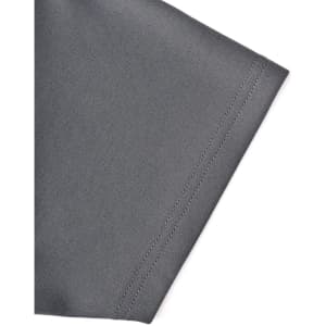 A close-up of a grey polo shirt sleeve featuring contrast stitching and a logo.