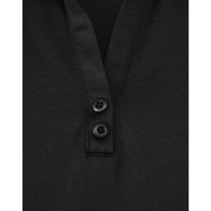 A black polo shirt featuring a textured fabric and two buttons at the neckline. It has a logo on it.