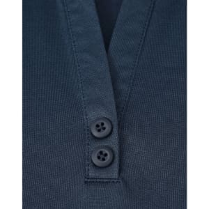 A close-up of a navy blue polo shirt featuring a V-neck and two buttons. The fabric appears sustainable.