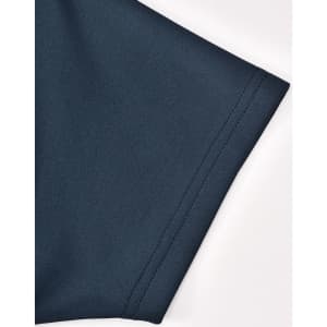 A dark teal polo shirt sleeve featuring sustainable poly/cotton fabric with a smooth texture and a logo.