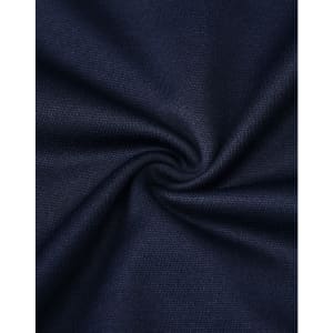 A close-up of navy fabric, showcasing its smooth texture and weave pattern, with a subtle swirl effect.