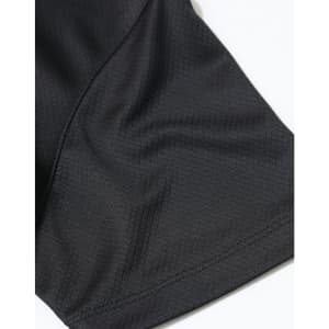 A close-up of a black jacquard knit fabric, highlighting the texture and stitching details of a polo shirt.