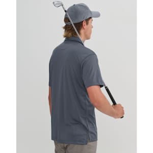 A grey sustainable jacquard knit short-sleeve polo shirt, featuring a logo, worn by a person holding a golf club.