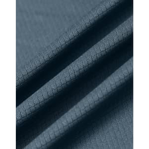 A close-up of a textured, sustainable jacquard knit fabric in a slate blue colour.