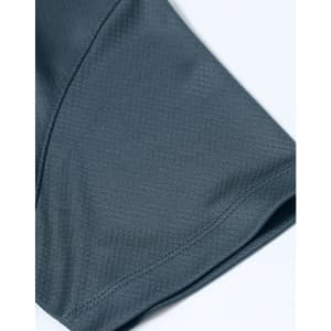 A close-up of a dark grey Jacquard knit fabric showing a textured pattern, part of a men's polo shirt.