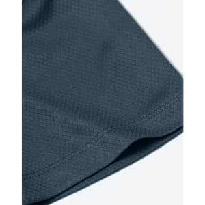 A close-up of a dark blue fabric featuring a jacquard knit pattern. The image highlights the texture and stitching details.