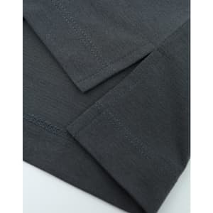 A close-up view of a grey polo shirt showcasing the fabric and stitching details. It features short sleeves and a logo.