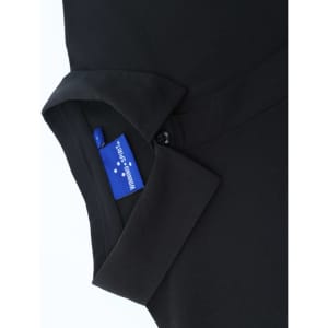 A black polo shirt featuring a collar and a tag, showcasing a sleek, high-performance design.