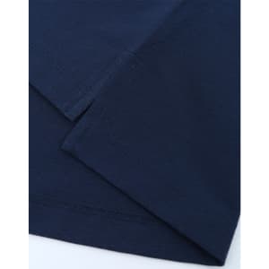 A close-up of navy blue fabric featuring stitched hems, showcasing the texture and quality of a polo shirt.