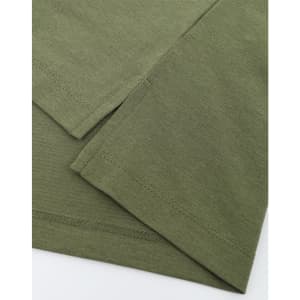 A close-up view of an olive green polo shirt highlighting the fabric texture and stitching details. The garment has a logo.