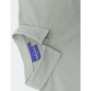 A grey ladies' high performance graphene polo with a collared neckline and a hidden button placket, featuring a logo.