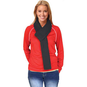 A woman wearing a dark grey cable knit scarf with a ribbed pattern, paired with a red top and jeans.