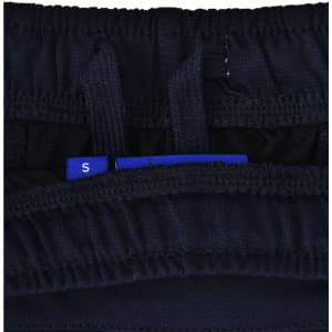 A close-up of navy blue sports shorts, featuring an interior waistband with adjustment tags and a logo.