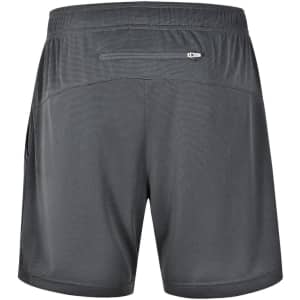 A pair of grey sports shorts featuring a back pocket and a logo on the side.