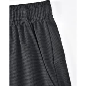 A close-up of black bamboo charcoal sports shorts featuring an elastic waistband and side pocket.